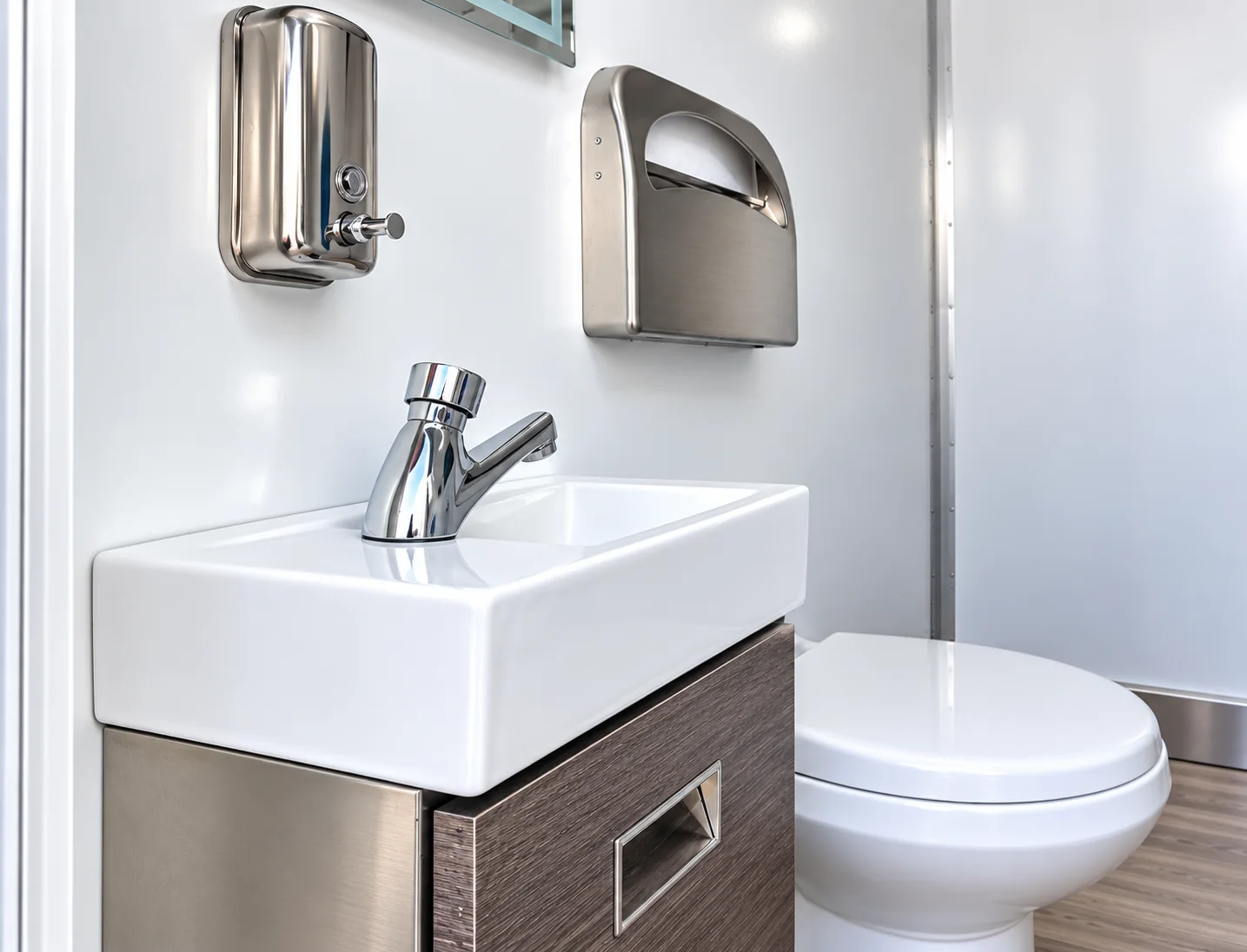 Restroom interior with vanity and toilet